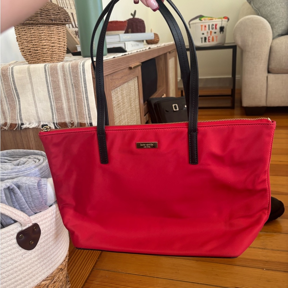 Red Kate Spade purse. NEVER USED